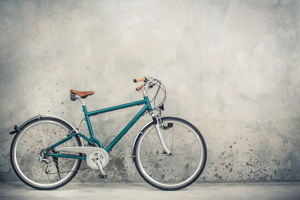 Used bike leaning up against wall